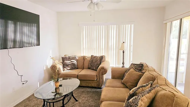 a living room with furniture and a window