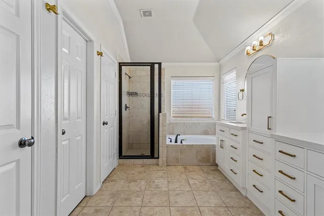 a bathroom with a glass door shower a sink and a mirror
