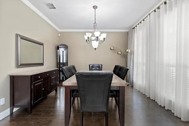 a view of a dining room with furniture and window