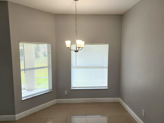 a room with window and a ceiling fan