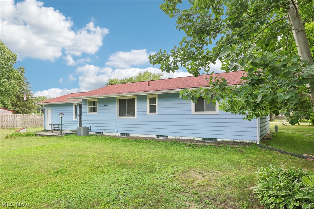 6618 Chapel Road Madison, OH 44057 - Photo 27 of 30 Rear view of house with a yard