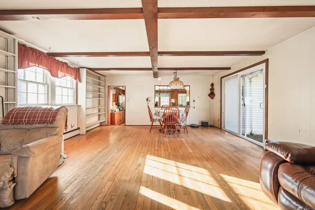 a view of a livingroom with furniture and wooden floor