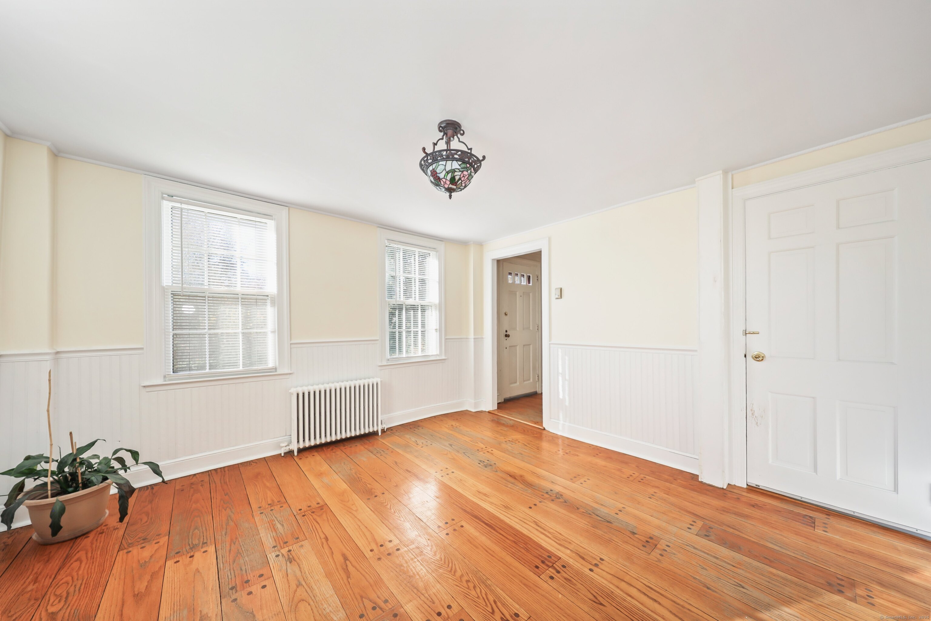 20 Hydelor Avenue Prospect, CT 06712 - Photo 16 of 40 a view of an empty room with wooden floor and a window