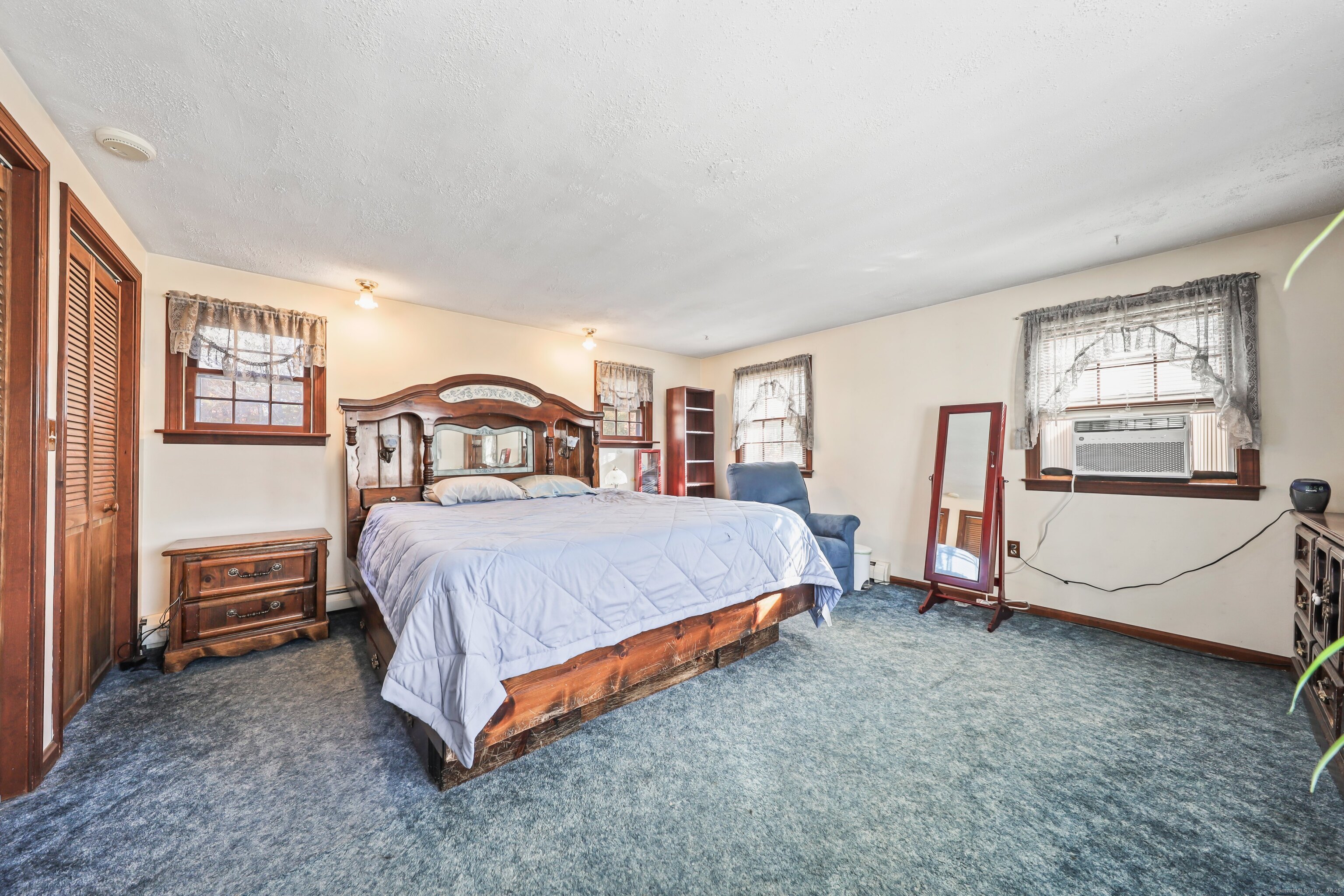 20 Hydelor Avenue Prospect, CT 06712 - Photo 26 of 40 a spacious bedroom with a bed and a cabinets