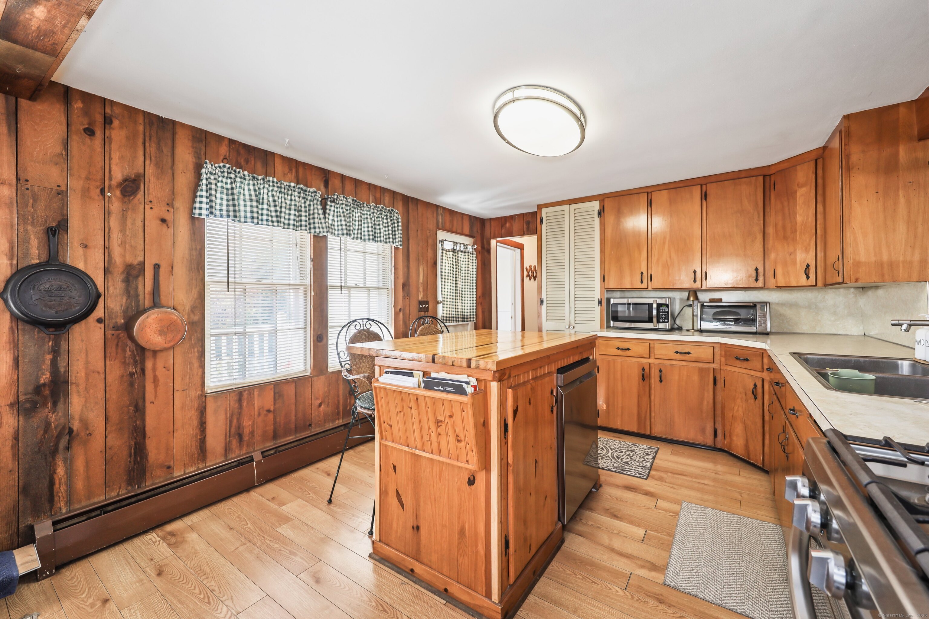 20 Hydelor Avenue Prospect, CT 06712 - Photo 7 of 40 a kitchen with stainless steel appliances a stove a sink and cabinets