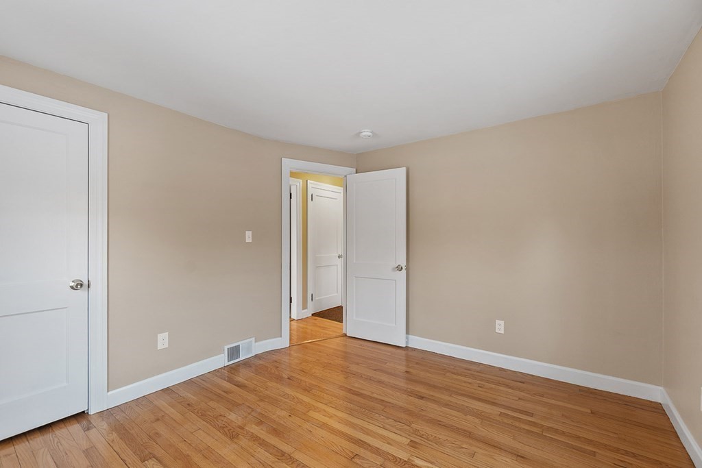 22 Parker Road Shirley, MA 01464 - Photo 16 of 41 a view of an empty room and wooden floor
