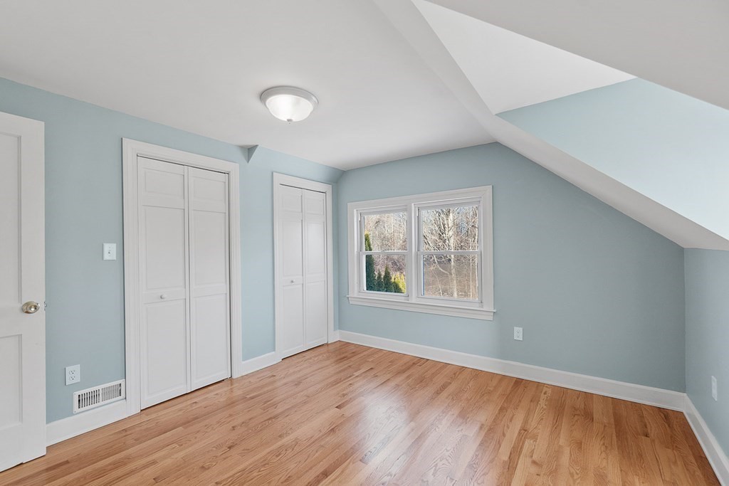 22 Parker Road Shirley, MA 01464 - Photo 25 of 41 a view of an empty room with wooden floor and a window