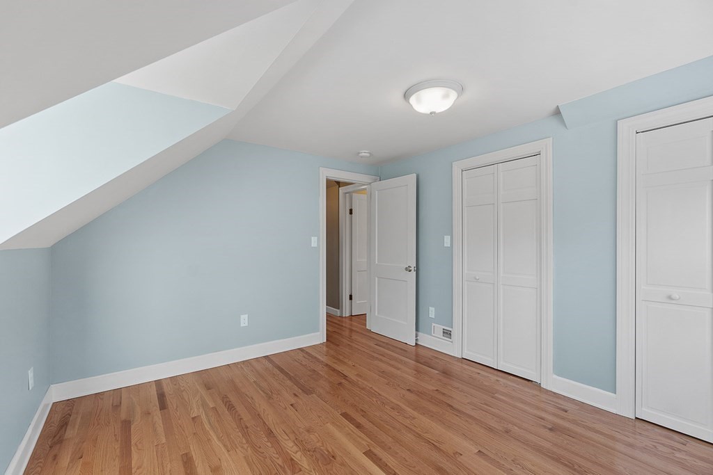 22 Parker Road Shirley, MA 01464 - Photo 26 of 41 a view of an empty room with wooden floor and closet