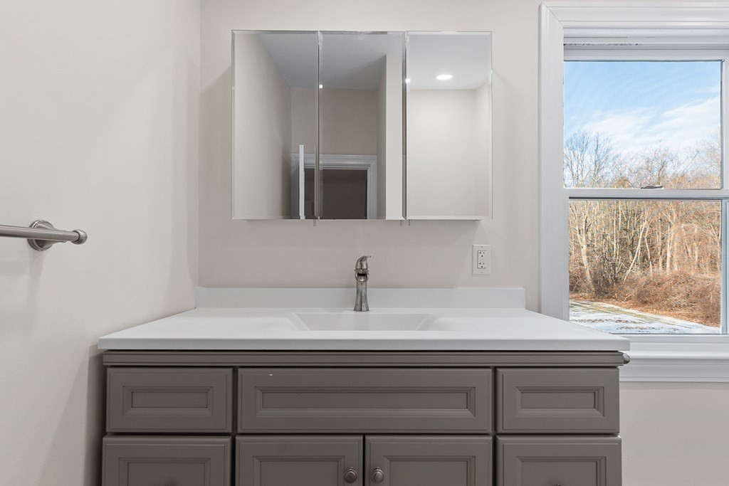 22 Parker Road Shirley, MA 01464 - Photo 31 of 41 a bathroom with a sink and a mirror