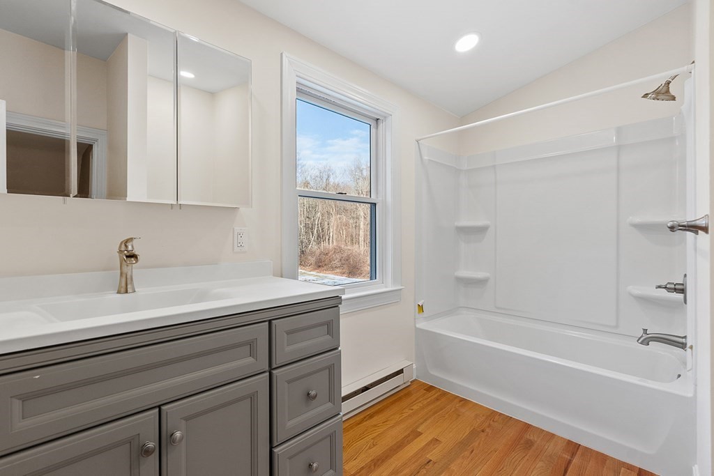 22 Parker Road Shirley, MA 01464 - Photo 32 of 41 a bath room with a sink and a bathtub