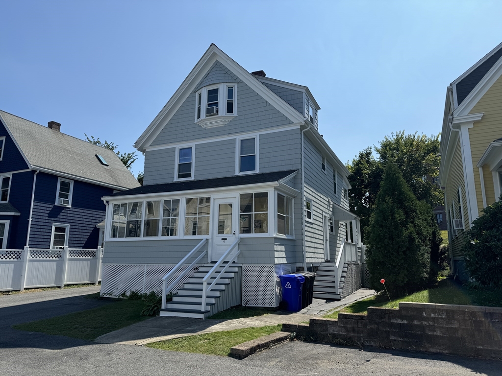 4 Barstow Street Boston, MA 02134 - Photo 2 of 11 a front view of a house with a yard