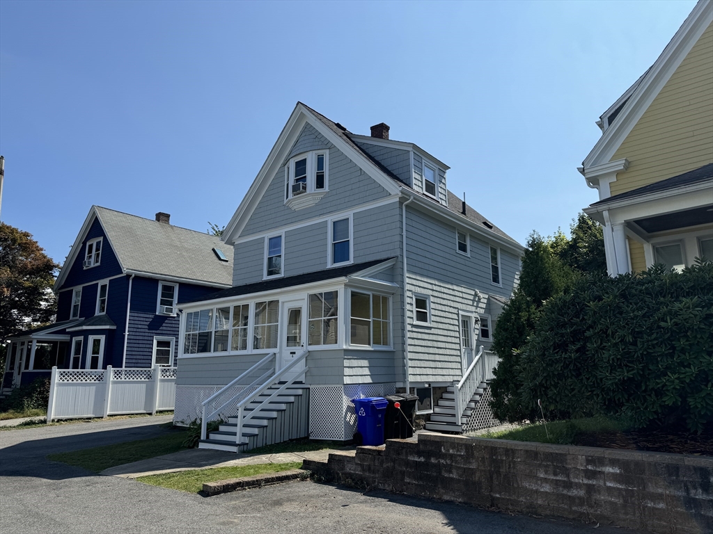 4 Barstow Street Boston, MA 02134 - Photo 3 of 11 a front view of a house with garden