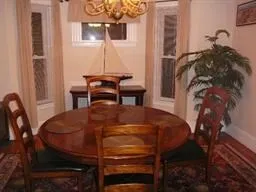 a dining room with furniture and window