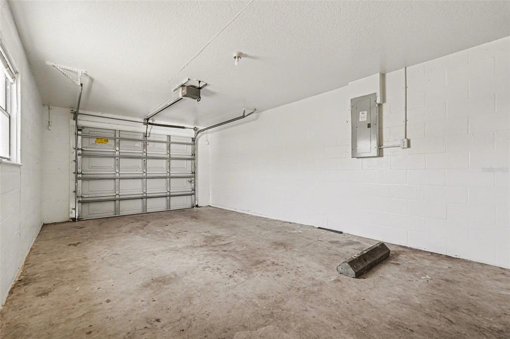 816 Angela Avenue, Unit B Rockledge, FL 32955 - Photo 13 of 34 an empty room with windows