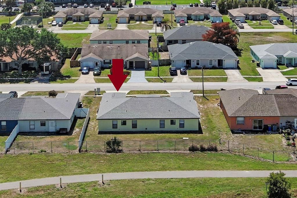 816 Angela Avenue, Unit B Rockledge, FL 32955 - Photo 15 of 34 a aerial view of a house with swimming pool and a yard