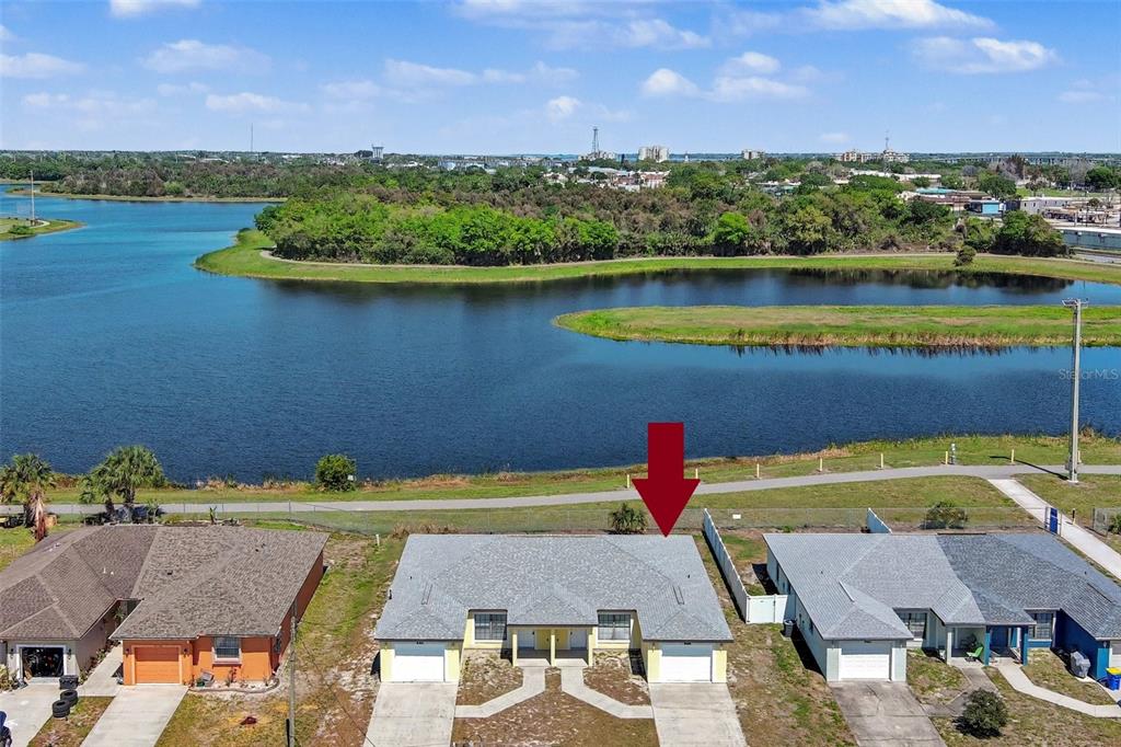 816 Angela Avenue, Unit B Rockledge, FL 32955 - Photo 2 of 34 an aerial view of a house with a lake view