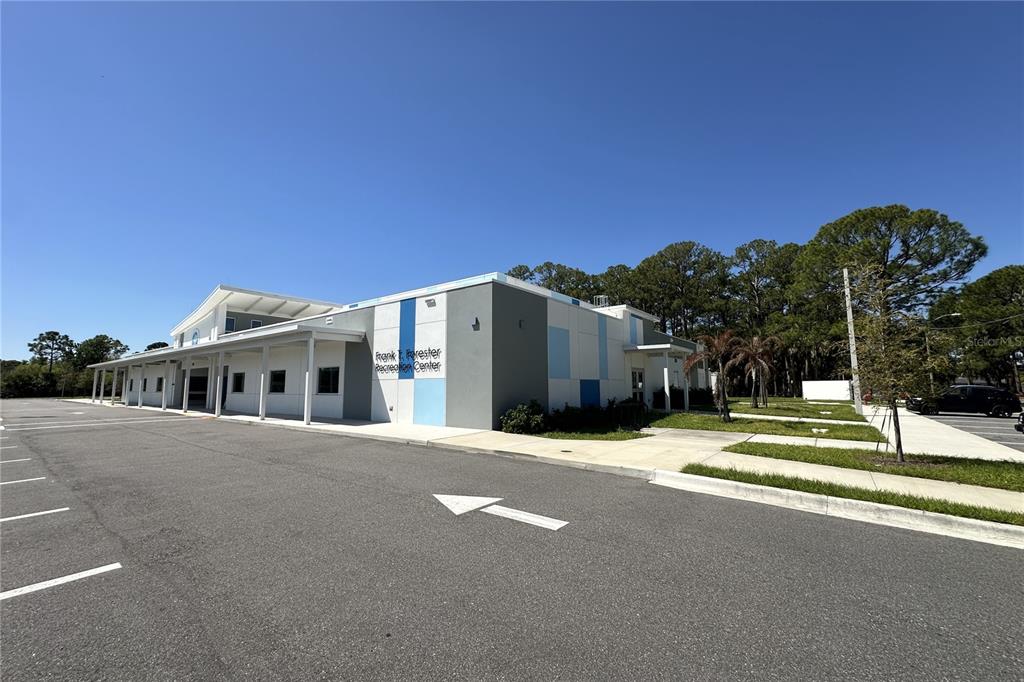 816 Angela Avenue, Unit B Rockledge, FL 32955 - Photo 26 of 34 a view of a house with a big yard and large trees