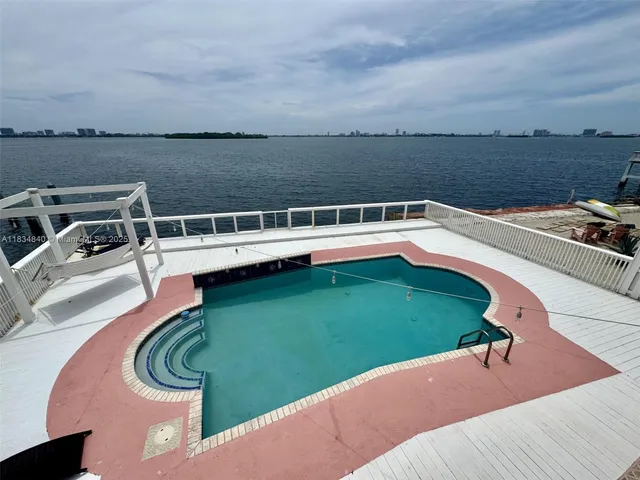 a view of a swimming pool with a patio