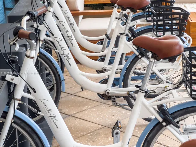 a large living room with stainless steel appliances kitchen island granite countertop furniture and a kitchen view