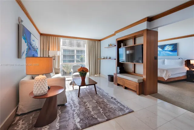 a living room with furniture and a lamp