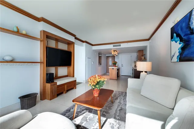 a kitchen with stainless steel appliances a sink a stove a refrigerator and cabinets