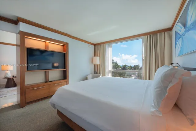 a bedroom with a bed and a couch