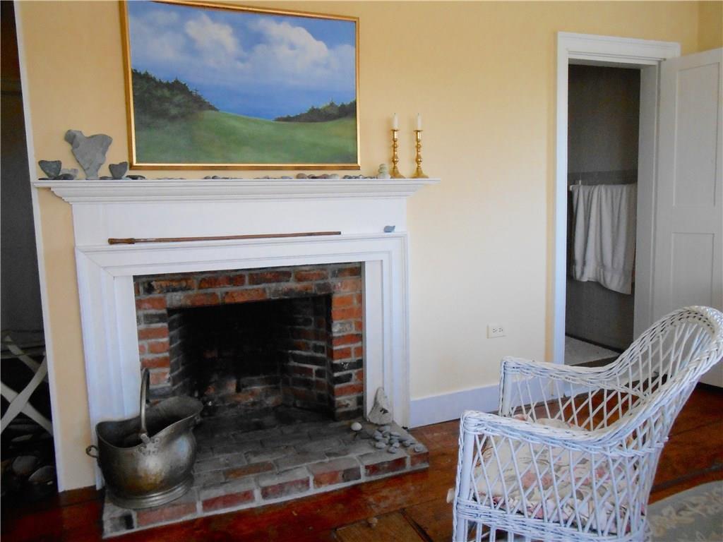 3 River House Road Castine, ME 04421 - Photo 14 of 26 Fireplace in bedroom and door to...