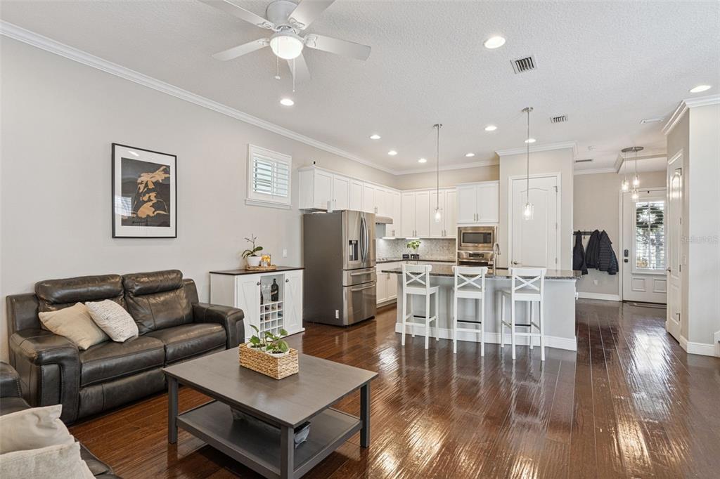 1565 Castile Street Celebration, FL 34747 - Photo 18 of 82 a living room with lots of furniture and kitchen view