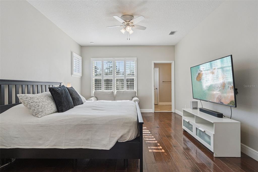 1565 Castile Street Celebration, FL 34747 - Photo 30 of 82 a bedroom with a bed and a flat screen tv