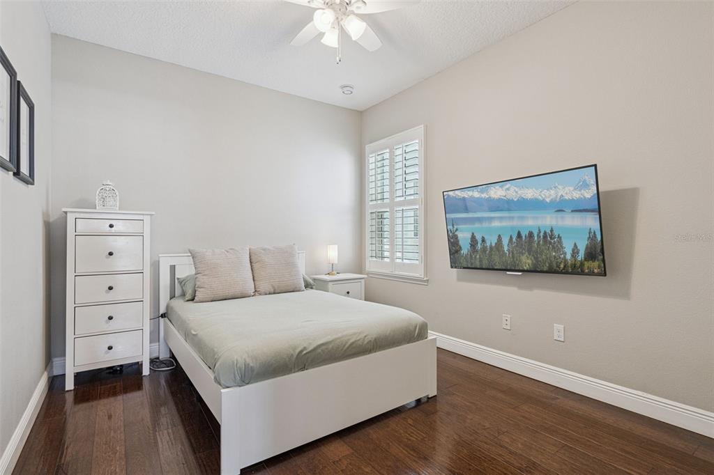 1565 Castile Street Celebration, FL 34747 - Photo 36 of 82 a bedroom with a bed and a window