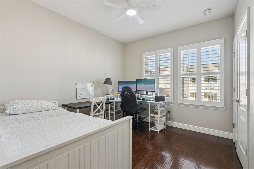 1565 Castile Street Celebration, FL 34747 - Photo 40 of 82 a view of a workspace with furniture and a window
