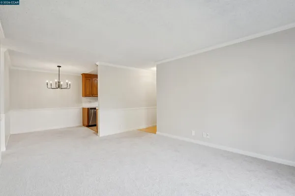 a view of empty room with a bathroom