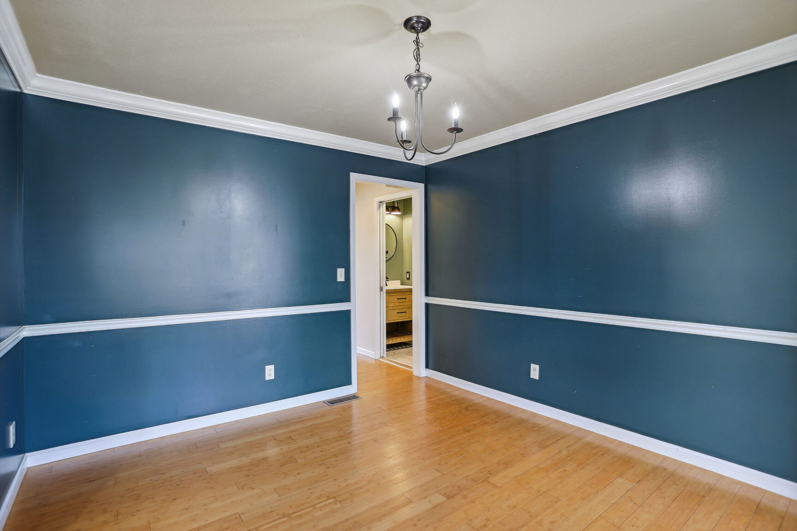 905 Switchgrass Lane Champaign, IL 61822 - Photo 12 of 51 en empty room with window and wooden floor