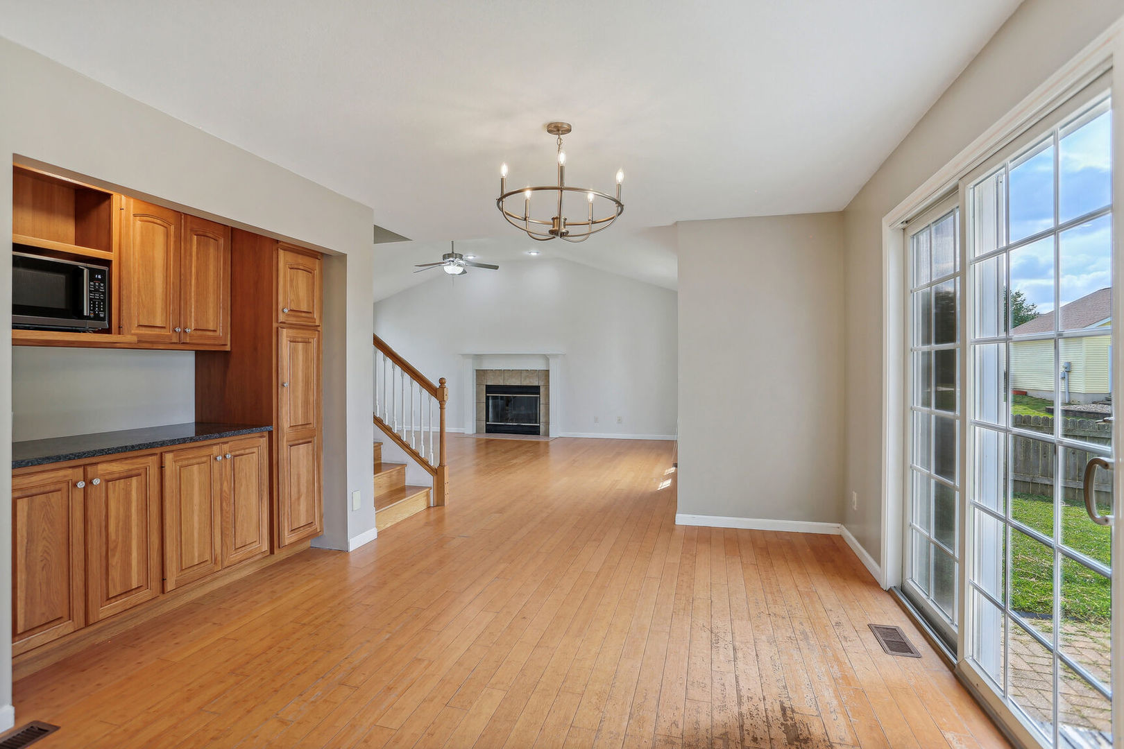 905 Switchgrass Lane Champaign, IL 61822 - Photo 14 of 51 a view of a kitchen with wooden floor and electronic appliances