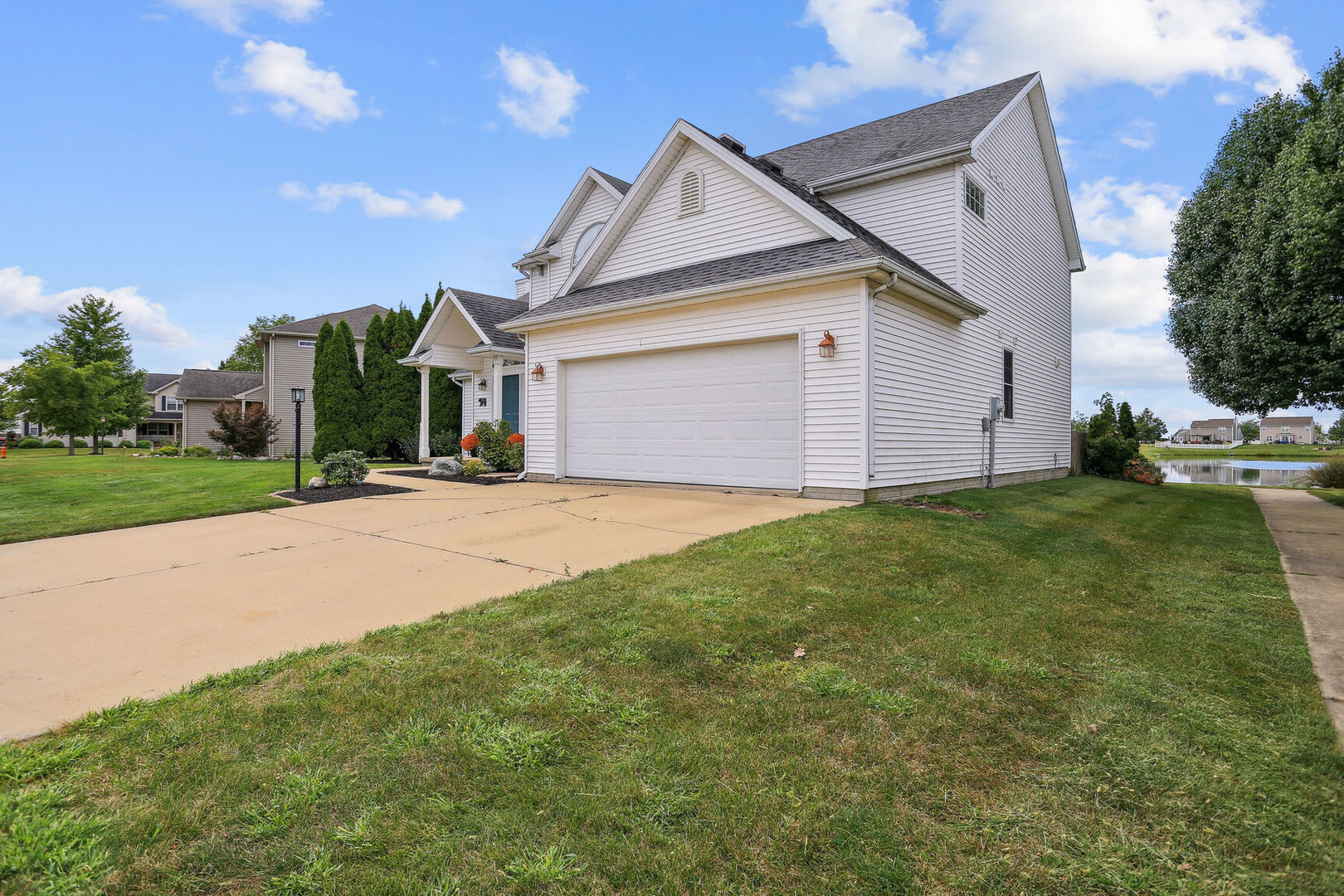 905 Switchgrass Lane Champaign, IL 61822 - Photo 2 of 51 a front view of a house with a yard and garage