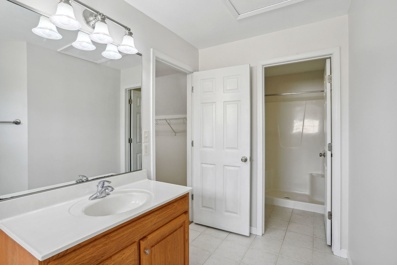 905 Switchgrass Lane Champaign, IL 61822 - Photo 25 of 51 a bathroom with a sink vanity and a mirror