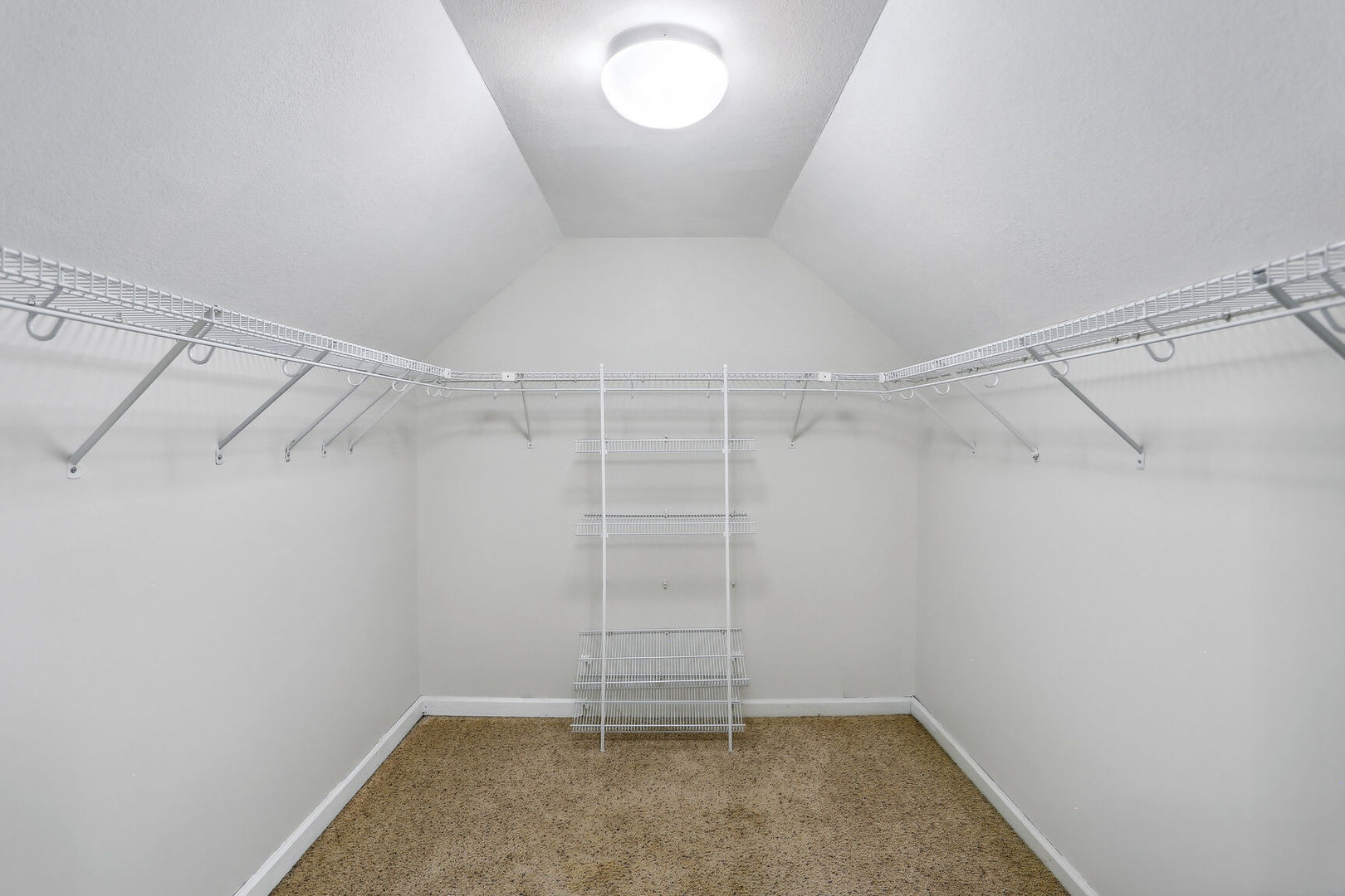 905 Switchgrass Lane Champaign, IL 61822 - Photo 26 of 51 a view of a room with racks on the wall