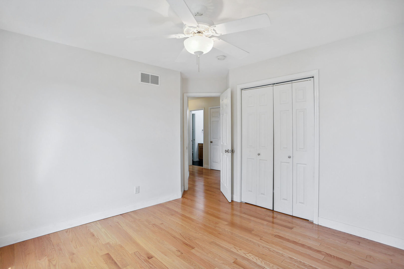 905 Switchgrass Lane Champaign, IL 61822 - Photo 30 of 51 a view of an empty room with wooden floor