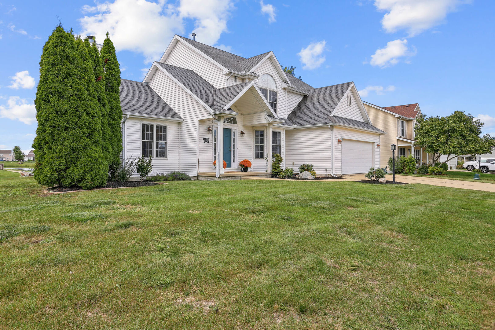 905 Switchgrass Lane Champaign, IL 61822 - Photo 3 of 51 a front view of a house with a yard