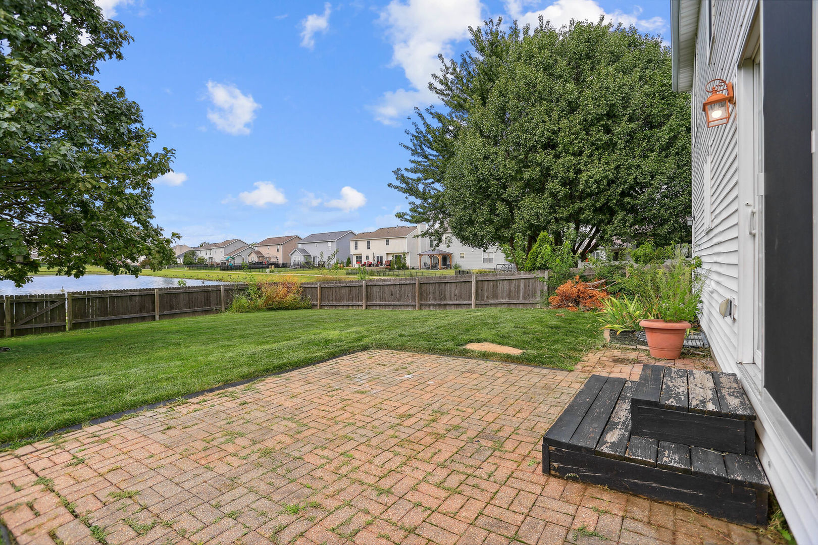905 Switchgrass Lane Champaign, IL 61822 - Photo 42 of 51 a view of a garden with a slide
