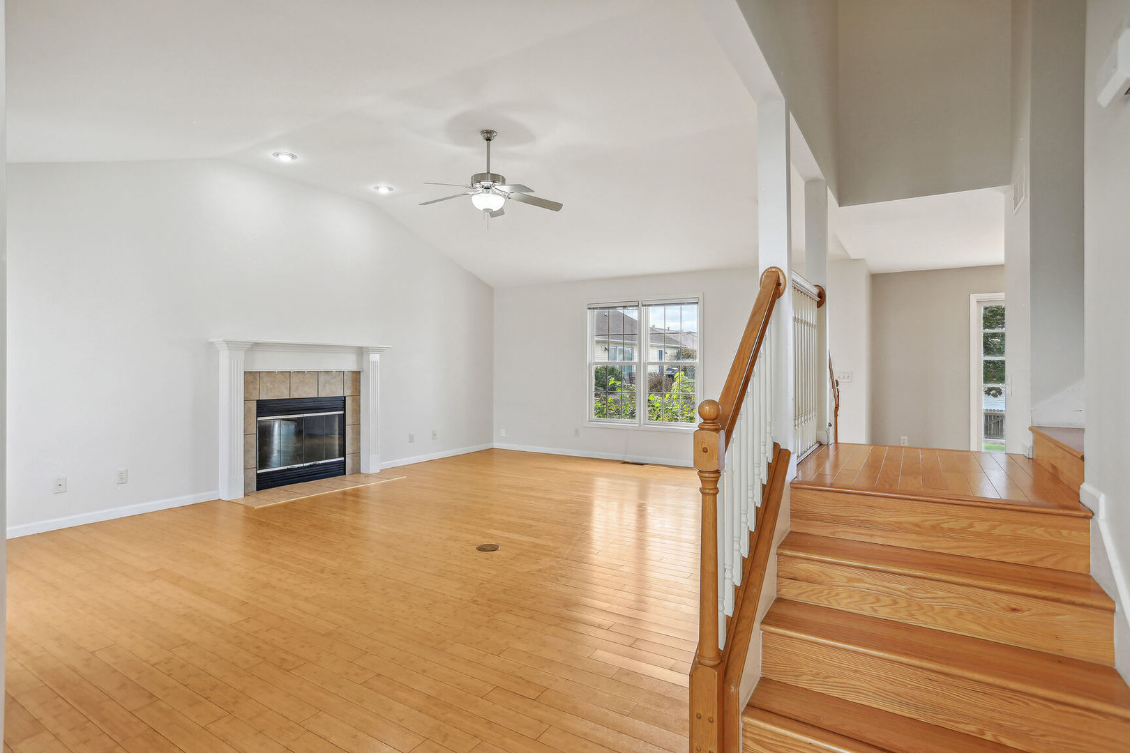 905 Switchgrass Lane Champaign, IL 61822 - Photo 7 of 51 a view of an empty room with a fireplace