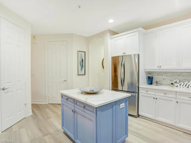 a kitchen with a sink stove and refrigerator