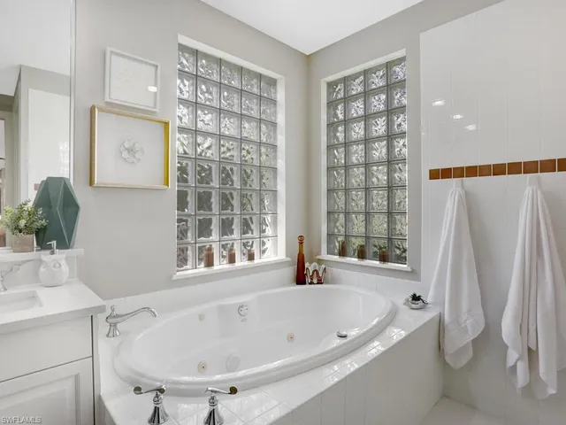 a bathroom with a bathtub and a sink