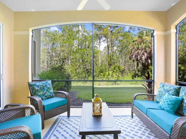 a living room with furniture and a garden