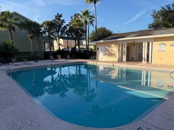 a view of a house with swimming pool