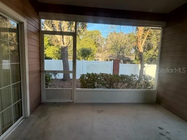 wooden floor in a room next to a window