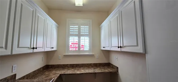 a view of kitchen and utility room