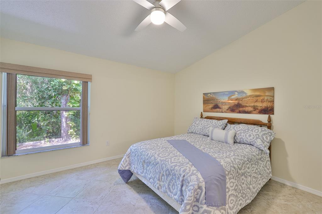 2431 Nantucket Harbor Loop, Unit 61 Sun City Center, FL 33573 - Photo 14 of 37 a bedroom with a bed and a window