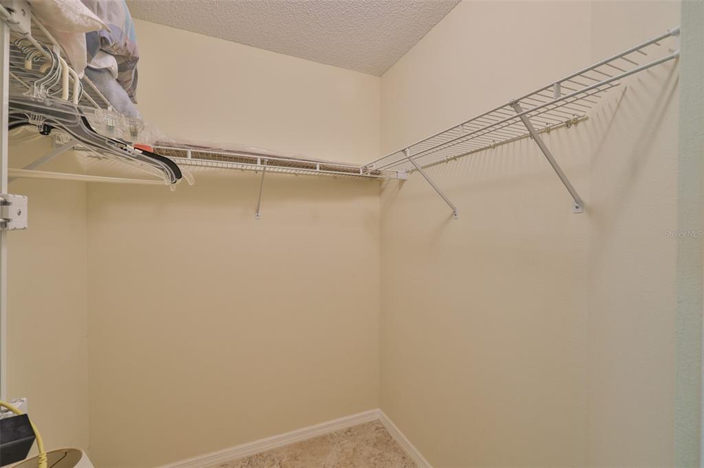 2431 Nantucket Harbor Loop, Unit 61 Sun City Center, FL 33573 - Photo 17 of 37 a view of a room with racks on the wall