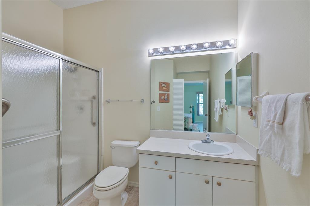 2431 Nantucket Harbor Loop, Unit 61 Sun City Center, FL 33573 - Photo 18 of 37 a bathroom with a sink a toilet and shower